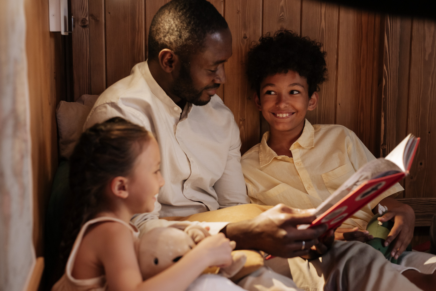 Father Reading Book to Kids